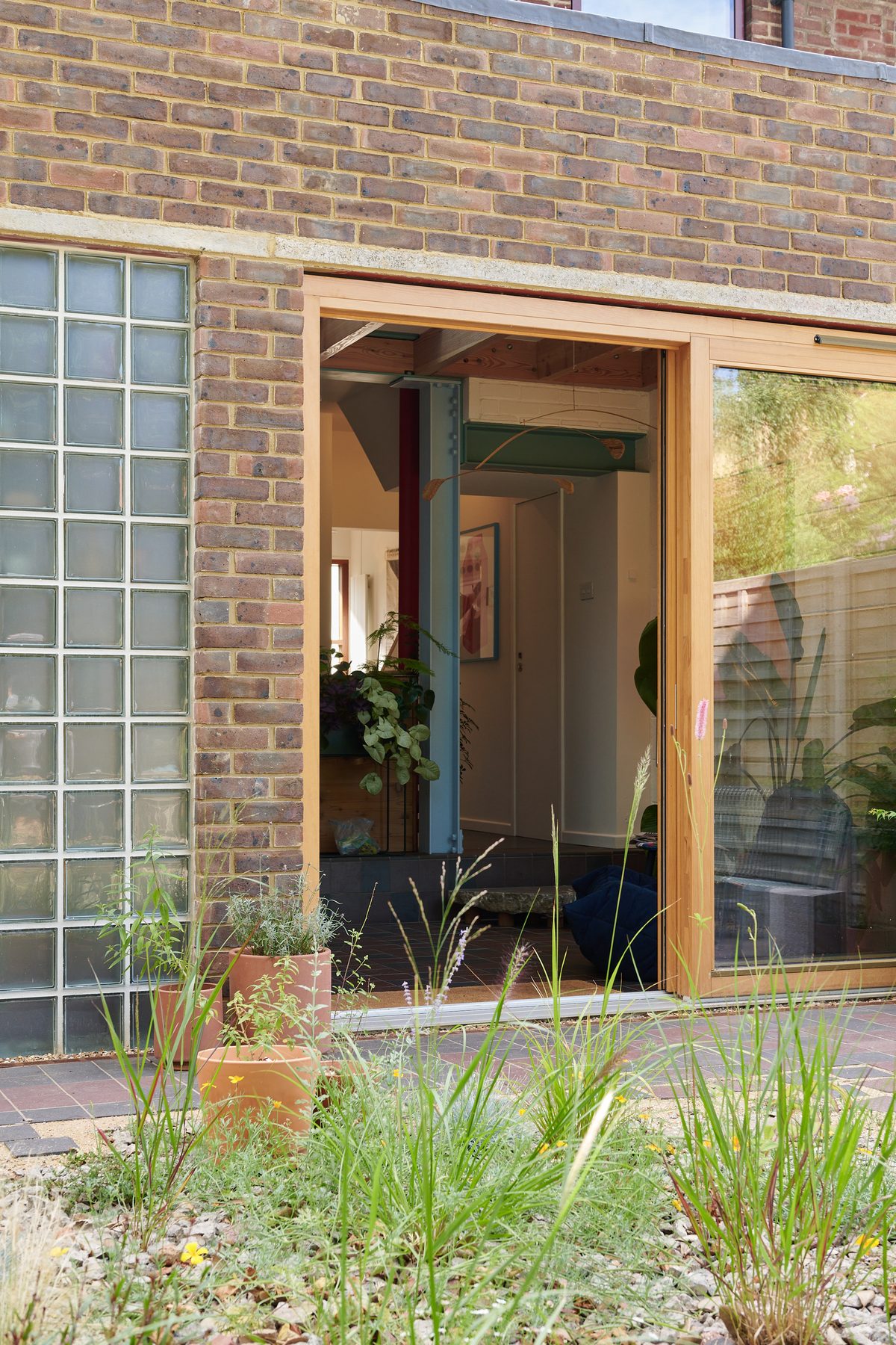 Brick rear extension with timber doors and garden
